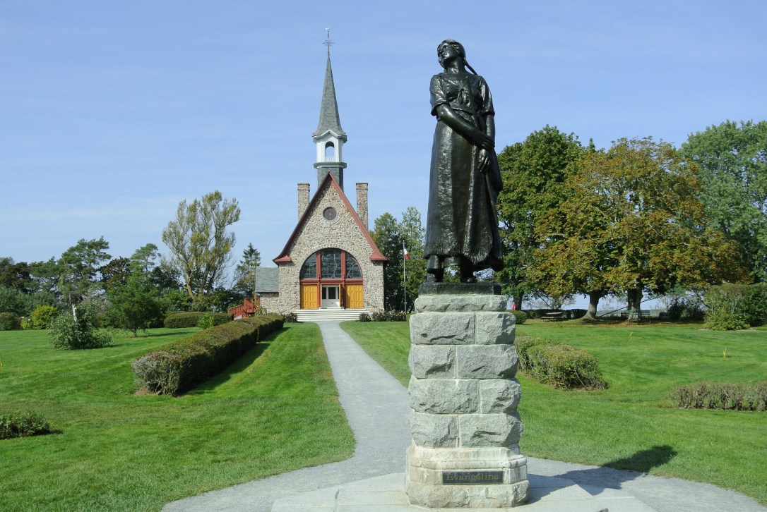The famous statue known as Evangaline is situated in front of a church at the historic Acadian site Grand Pre.