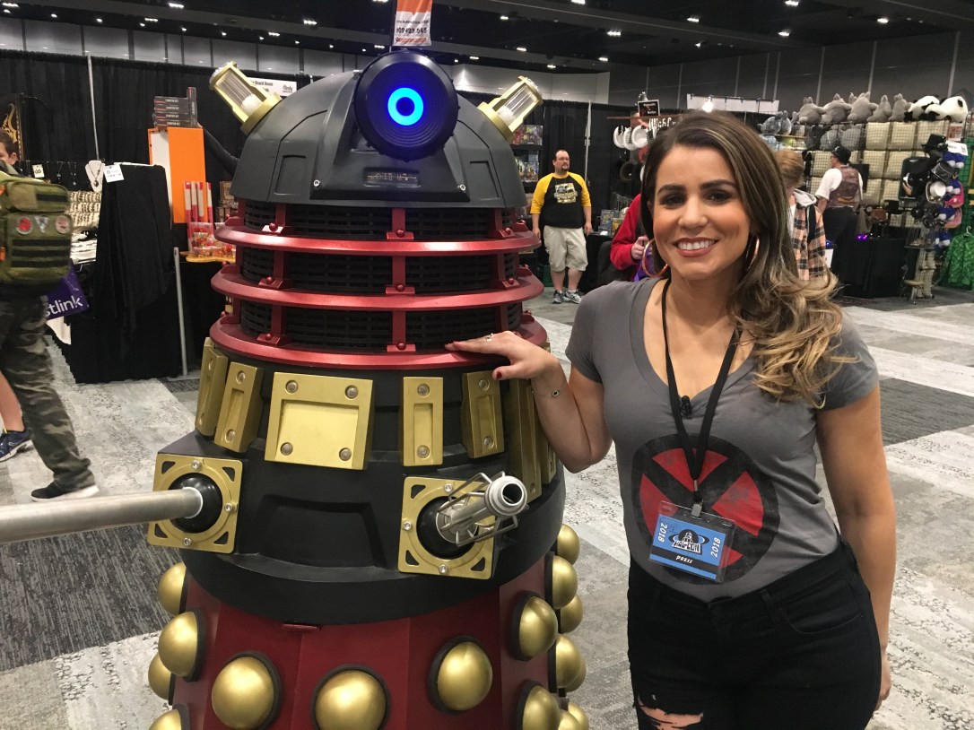 A woman stands with a robot at Hal-Con, a sci-fi and gaming convention that is held annually in Halifax, Nova Scotia.